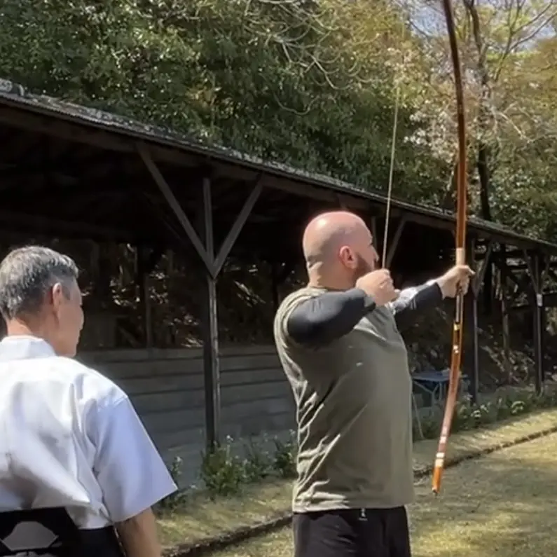 Olgun is practising how to draw Yumi (Japanese long bow) in Mie Prefecture Japan with Urano Yuji Sensei [7th Dan Kyudo]